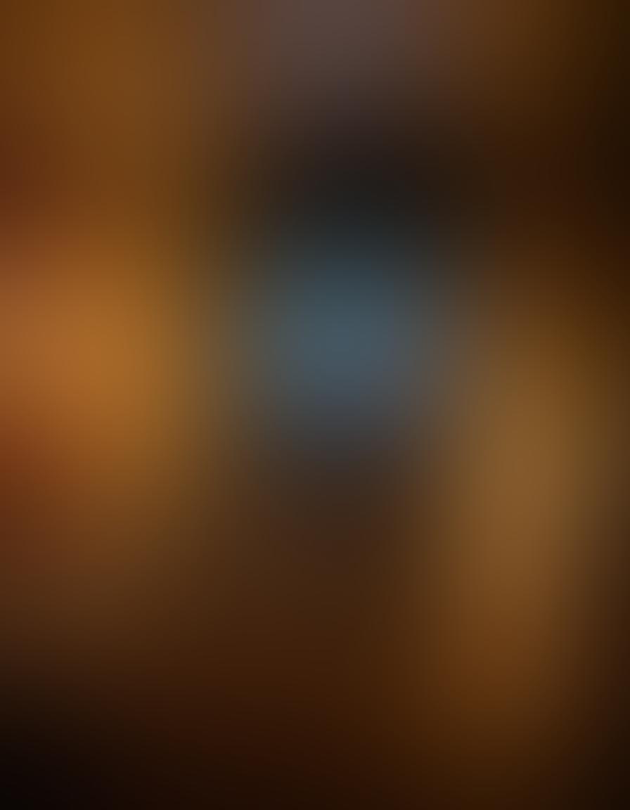 A cozy, dimly lit room adorned with soft pillows and flowing drapes, featuring a couple engaged in laughter while watching a colorful screen displaying scenes from vibrant erotic documentaries. Emphasize the playful atmosphere, with subtle humorous elements like popcorn and quirky decorations surrounding them. Add a touch of elegance with artistic lighting that captures a mood of enjoyment and intimacy. super-realistic. warm colors. inviting ambiance.